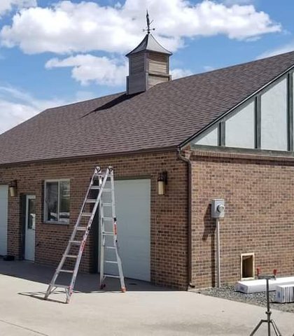 Gutter installation on a brick commercial building