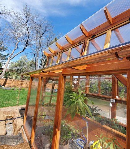 Copper gutter on a cedar greenhouse