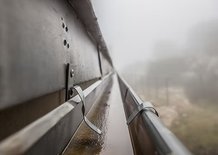 Close-up of a seamless gutter channeling rainwater