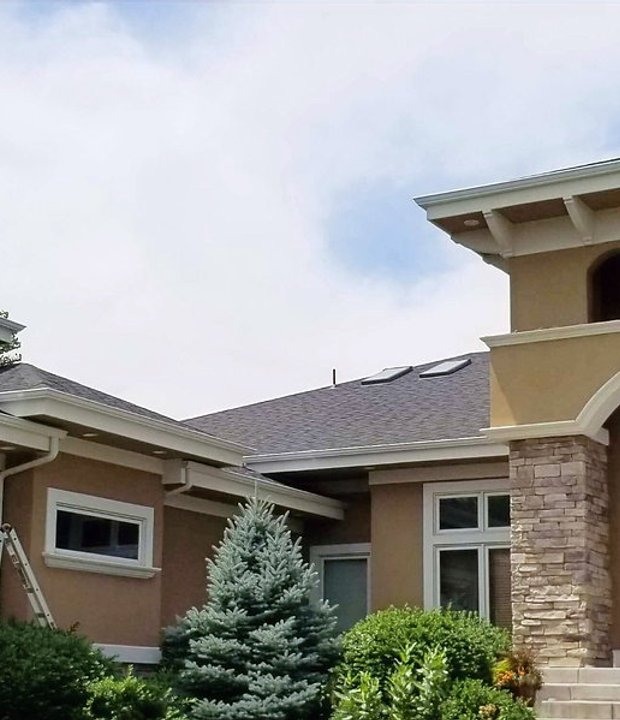 Steep-roof Northern Colorado home where sliding snow threatens the gutters