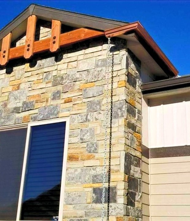 Seamless gutters on a Northern Colorado stone and stucco home